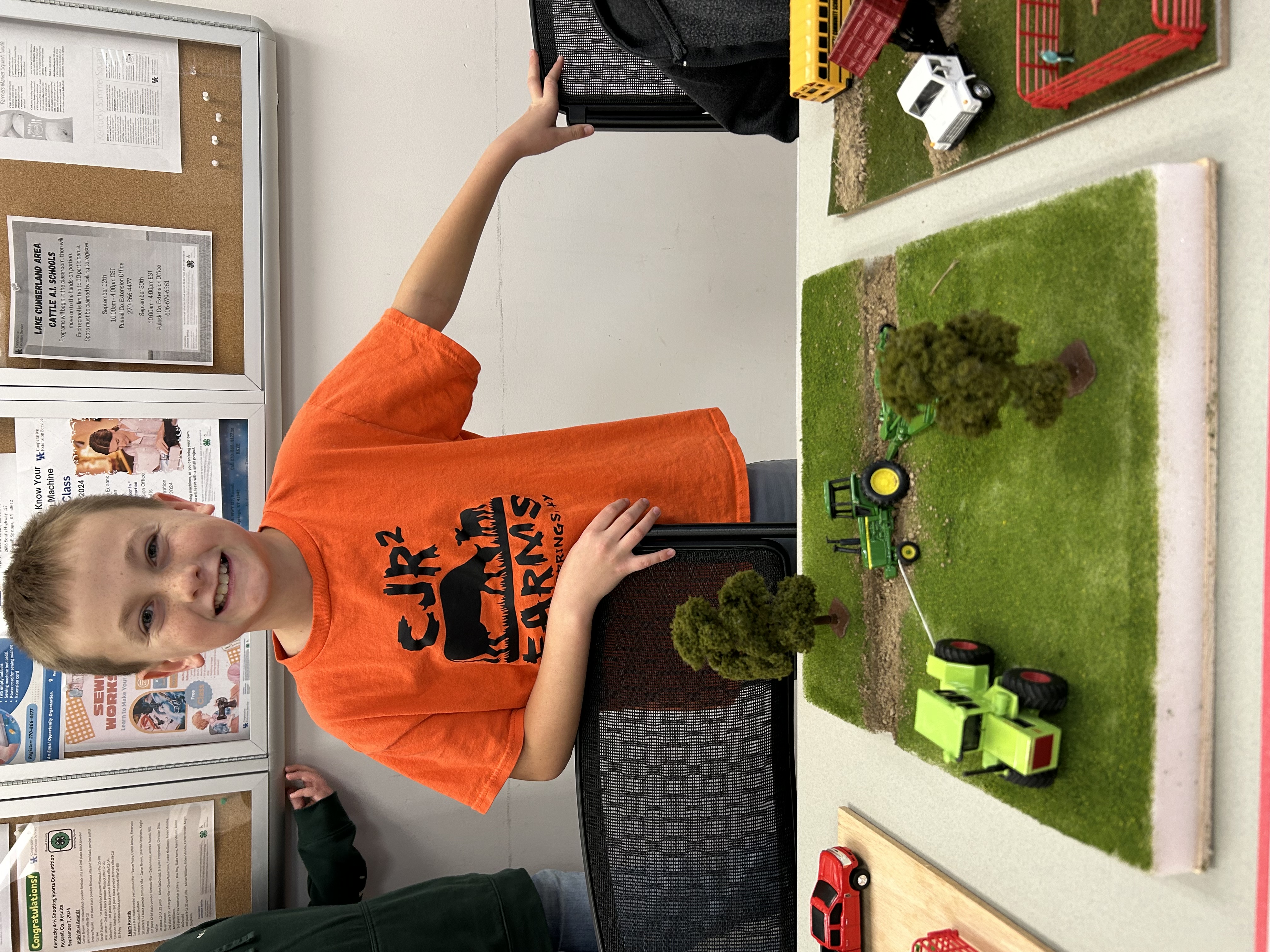 Boy with farm toys