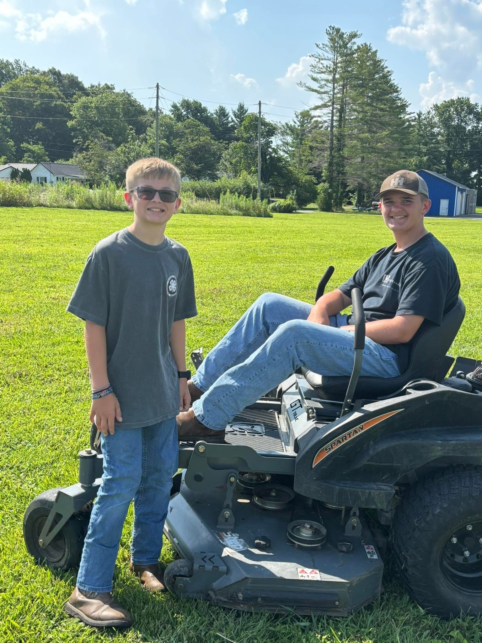 boys with lawn mower