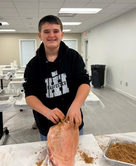 Boy curing country ham