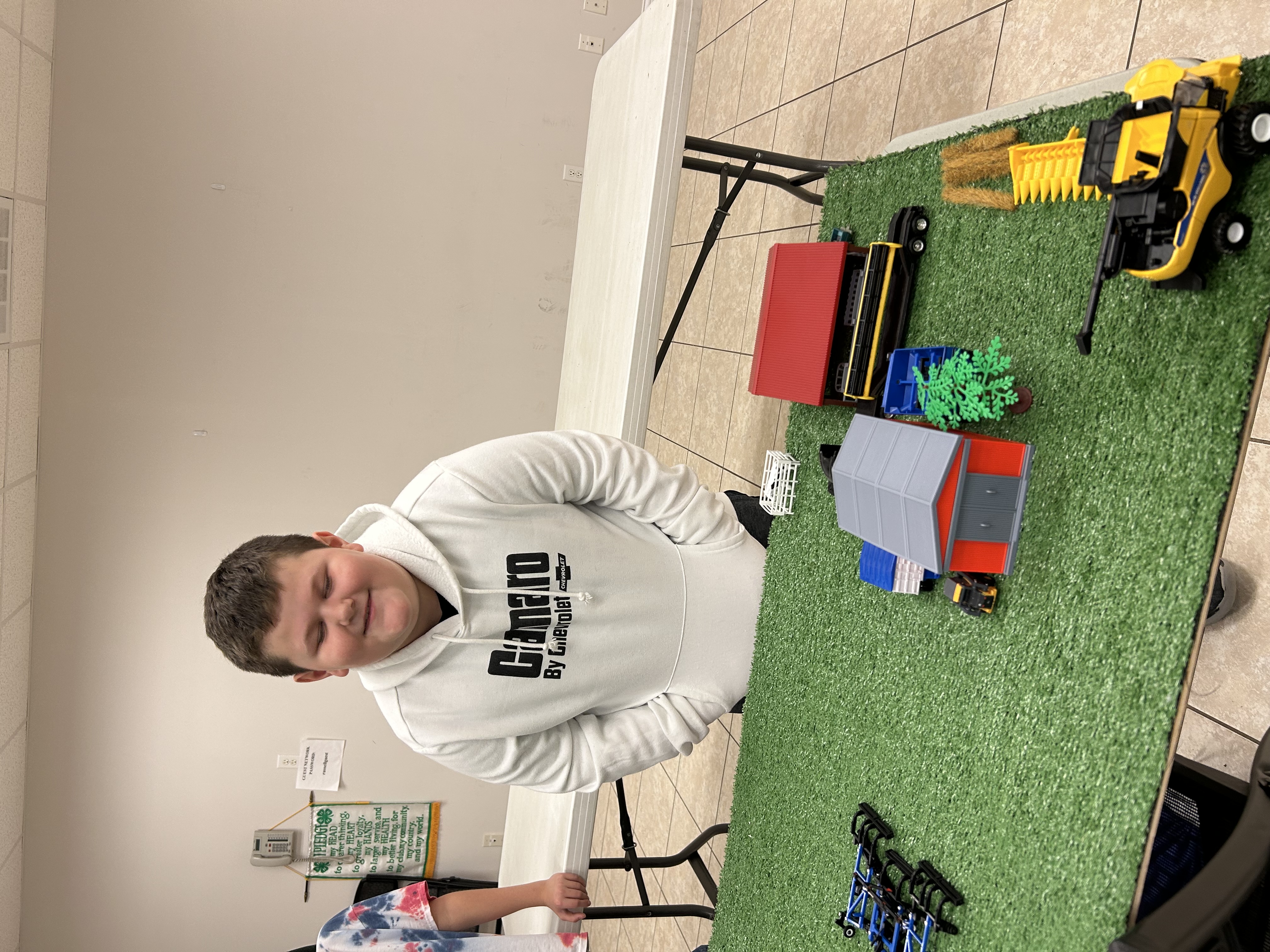 Boy with farm toys