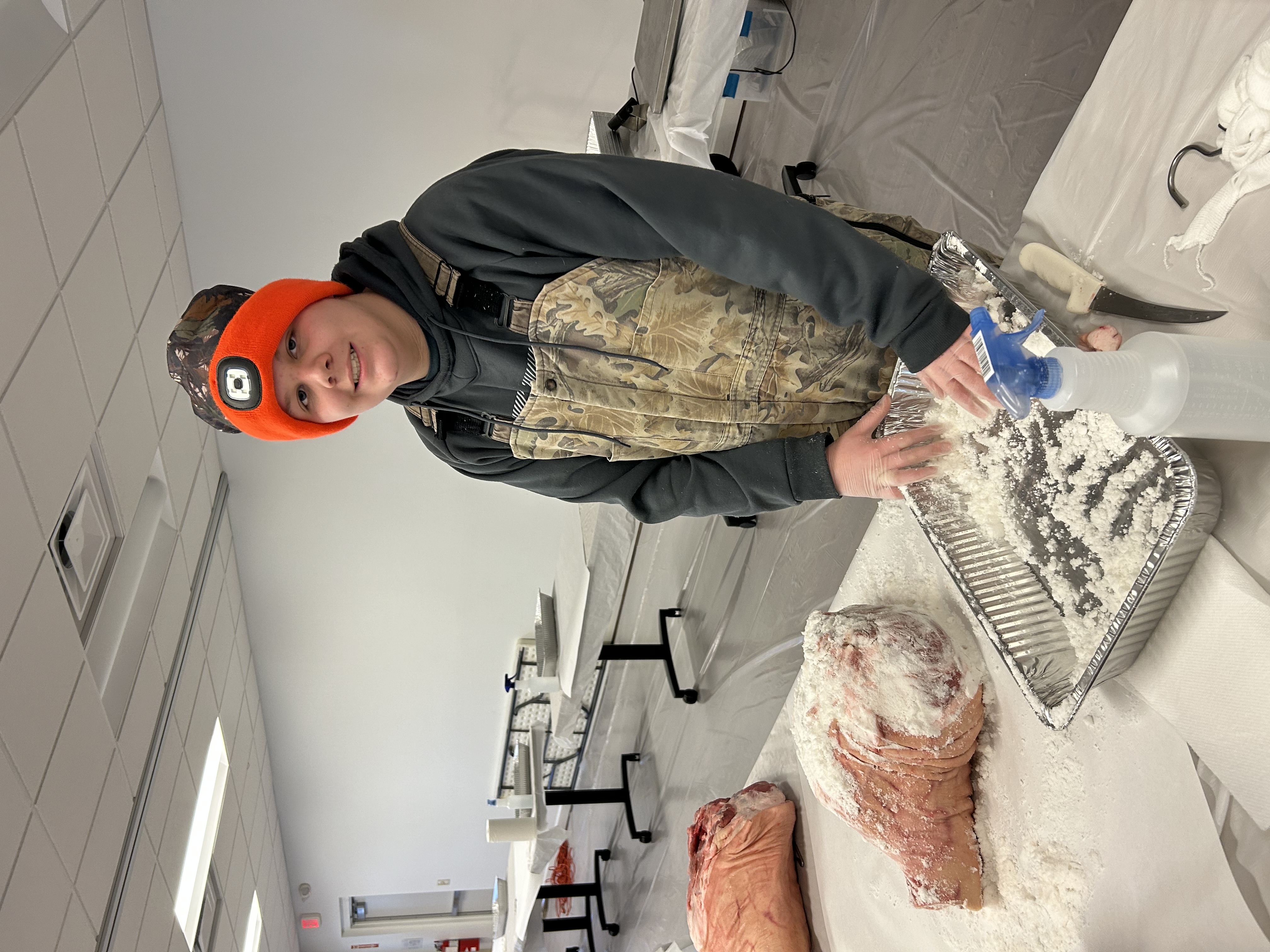 Boy curing country ham