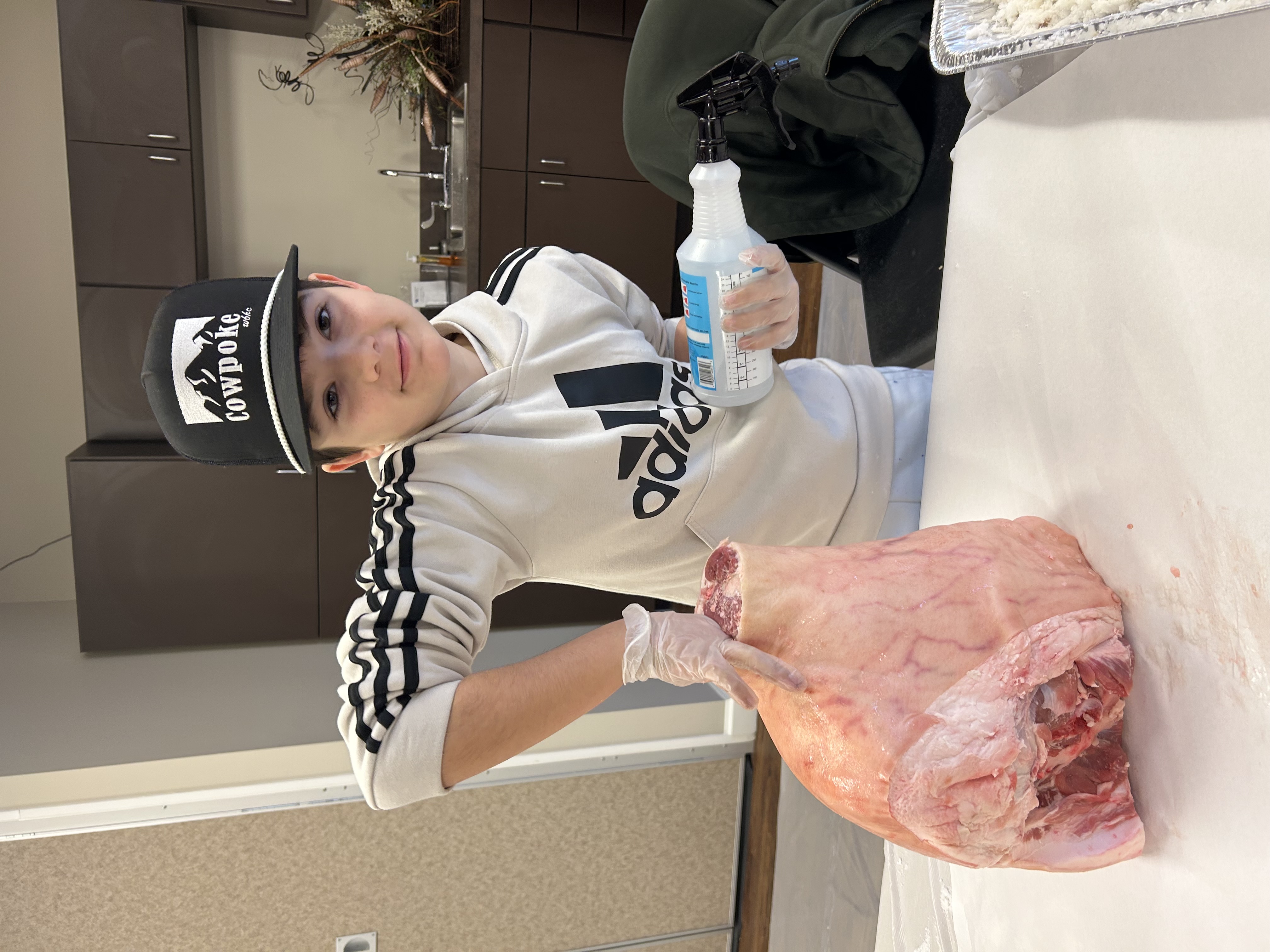 Boy curing country ham