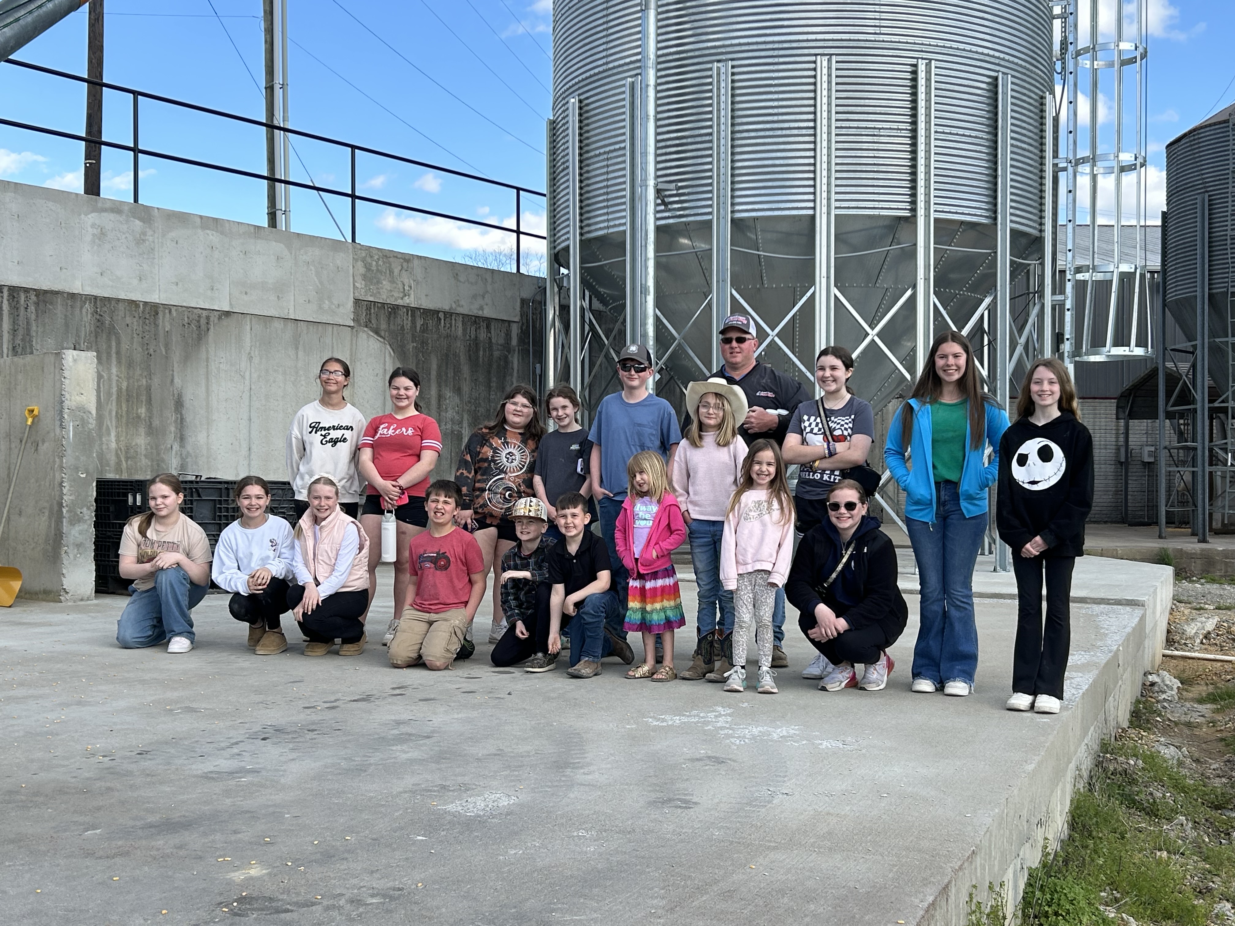 Children in front of grain bin