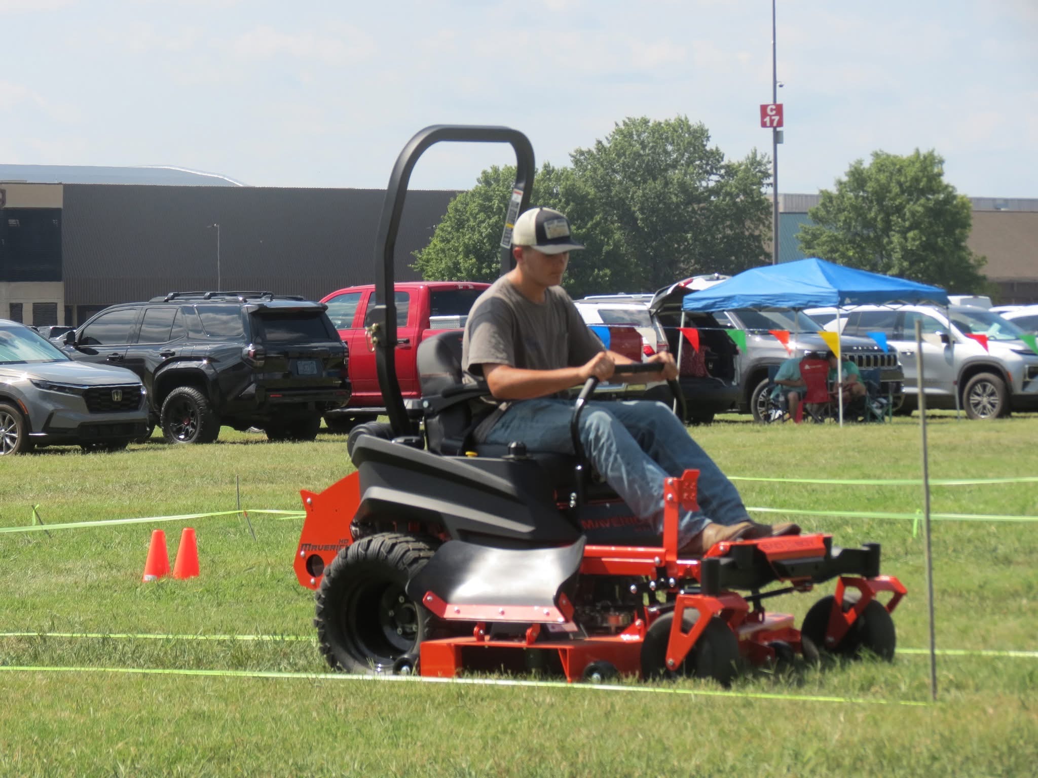 boy on lawn mower
