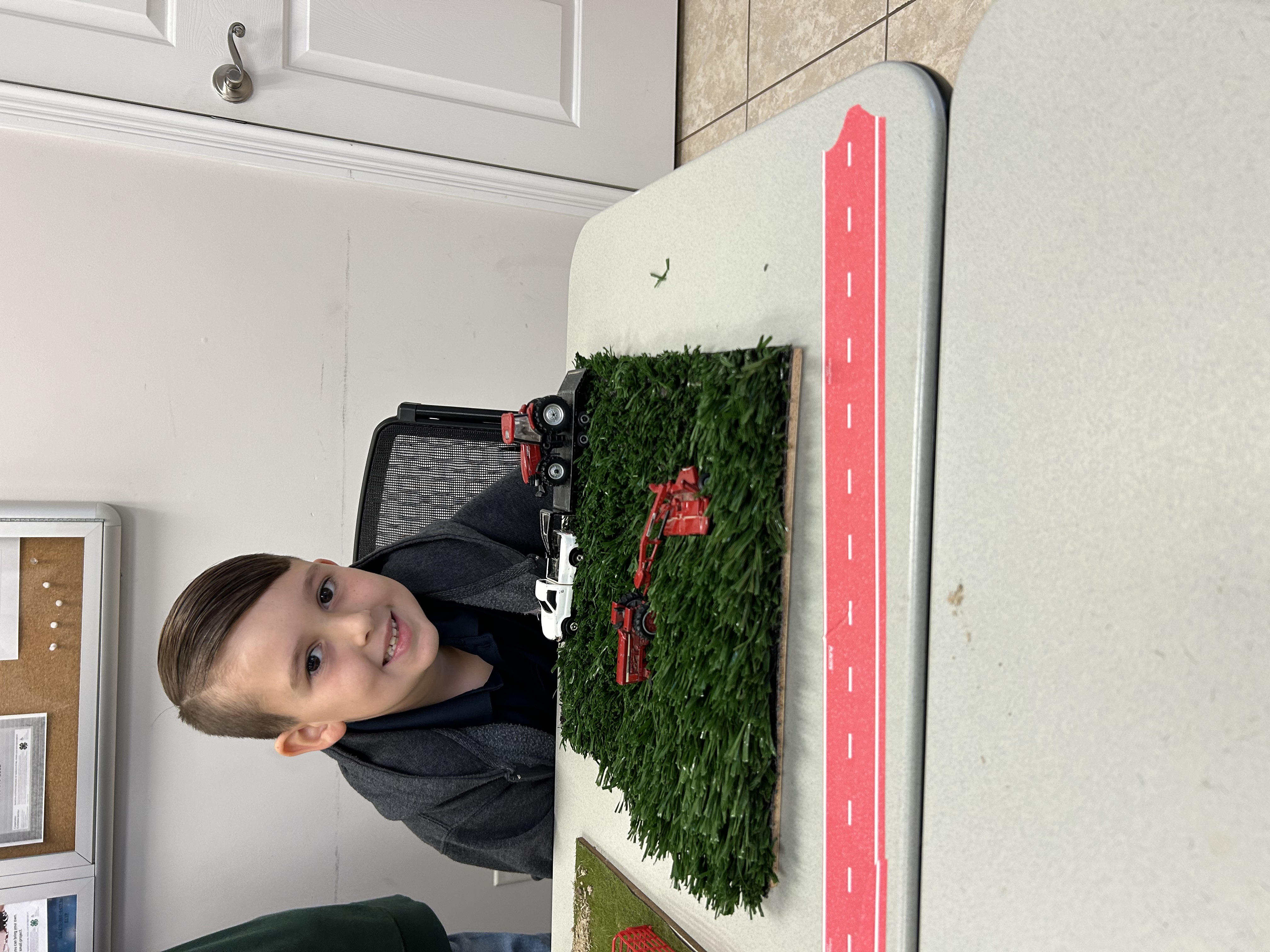 Boy with farm toys