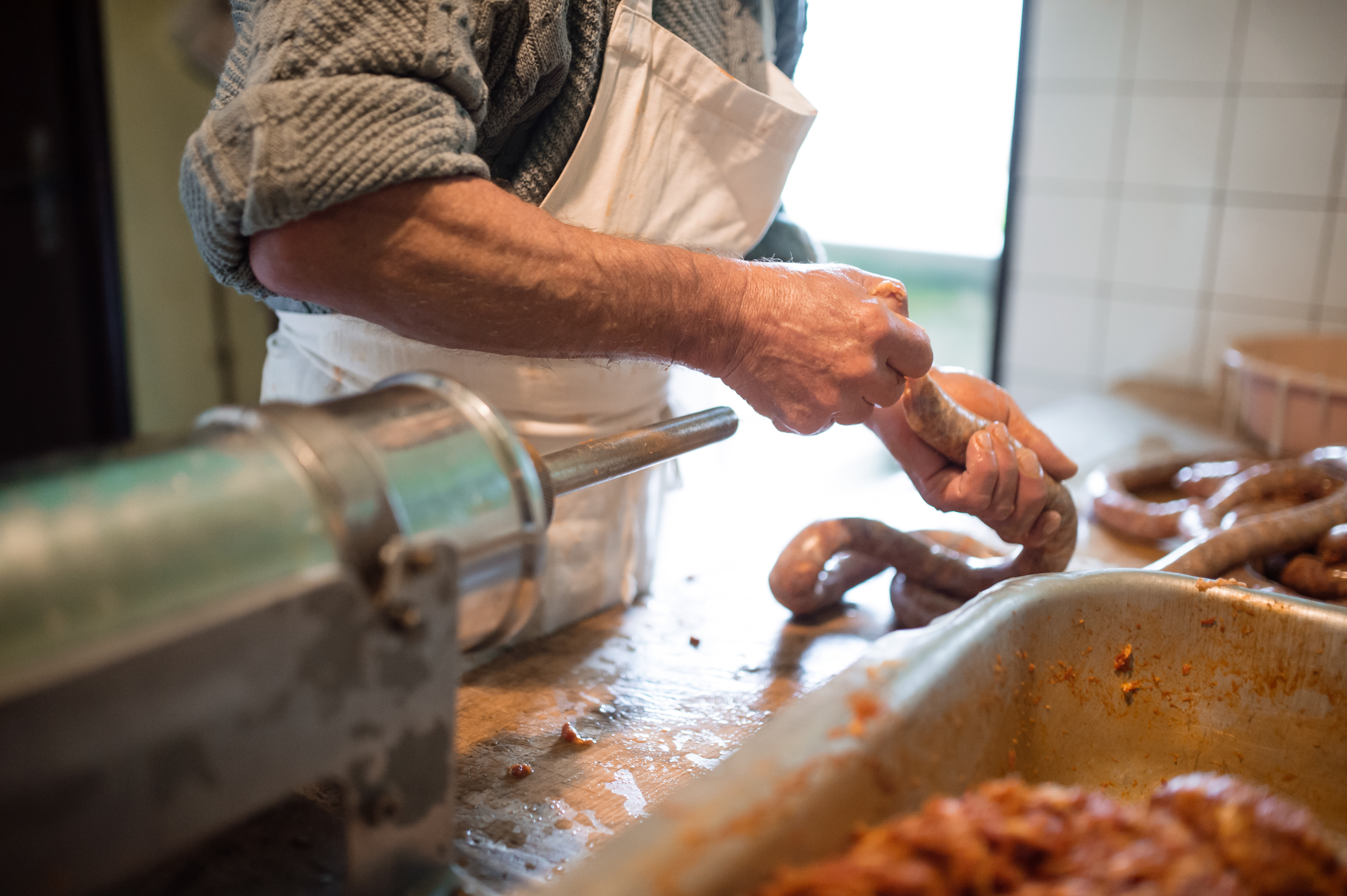 man making sausage